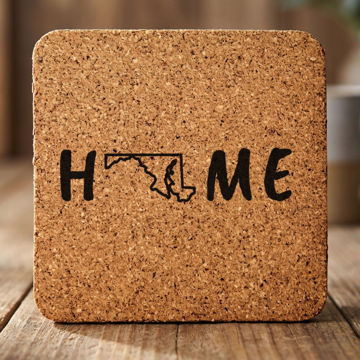 Maryland square cork coaster engraved with HOME using the state outline as the letter O
