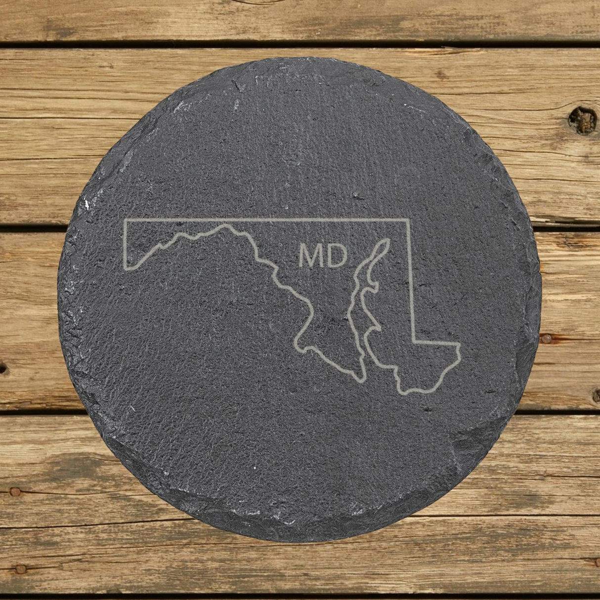 Maryland round slate coaster engraved with the state outline and MD initials