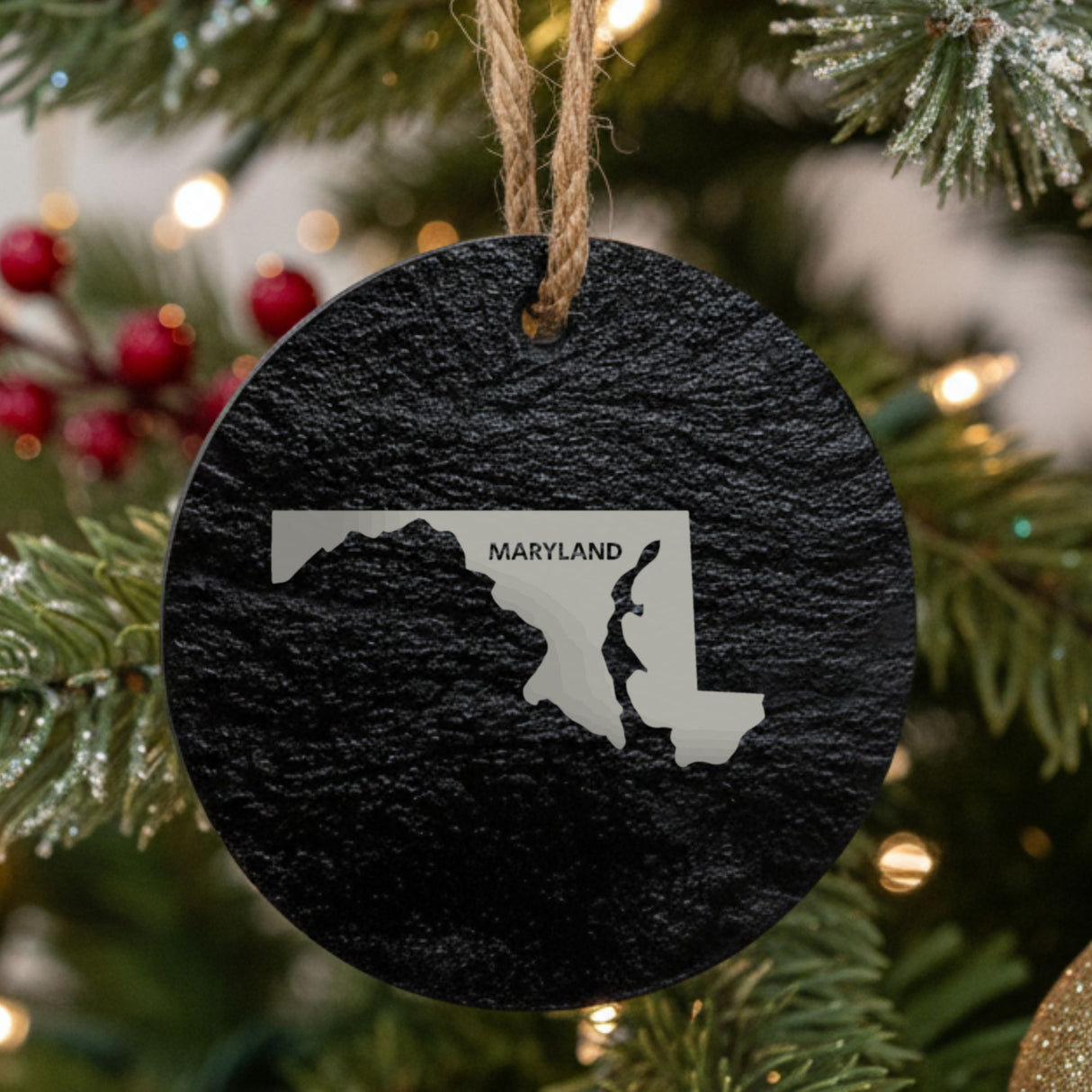 Maryland round slate Christmas ornament engraved with the state shape and MARYLAND in bold lettering