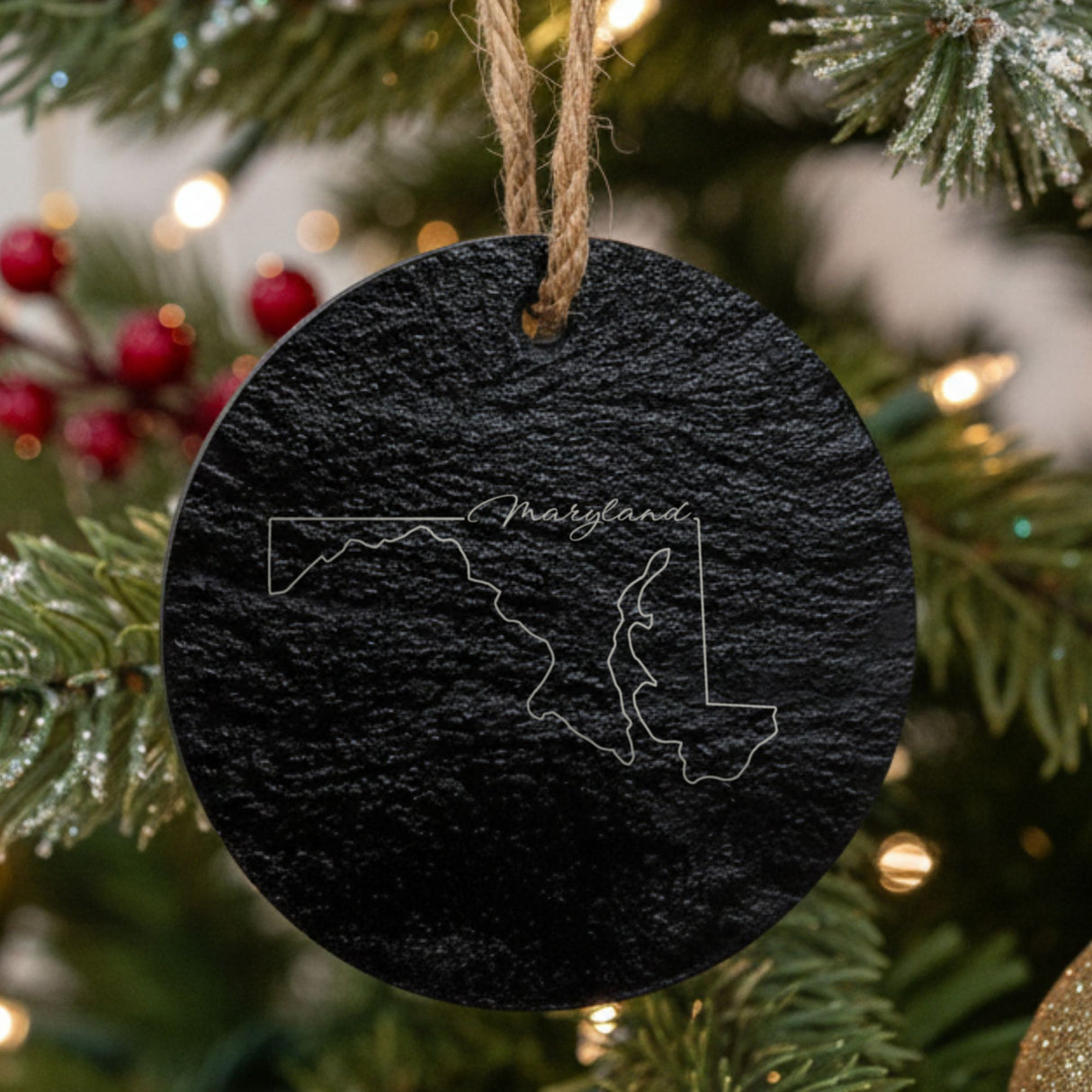 Maryland round slate Christmas ornament engraved with the state outline and Maryland in script lettering