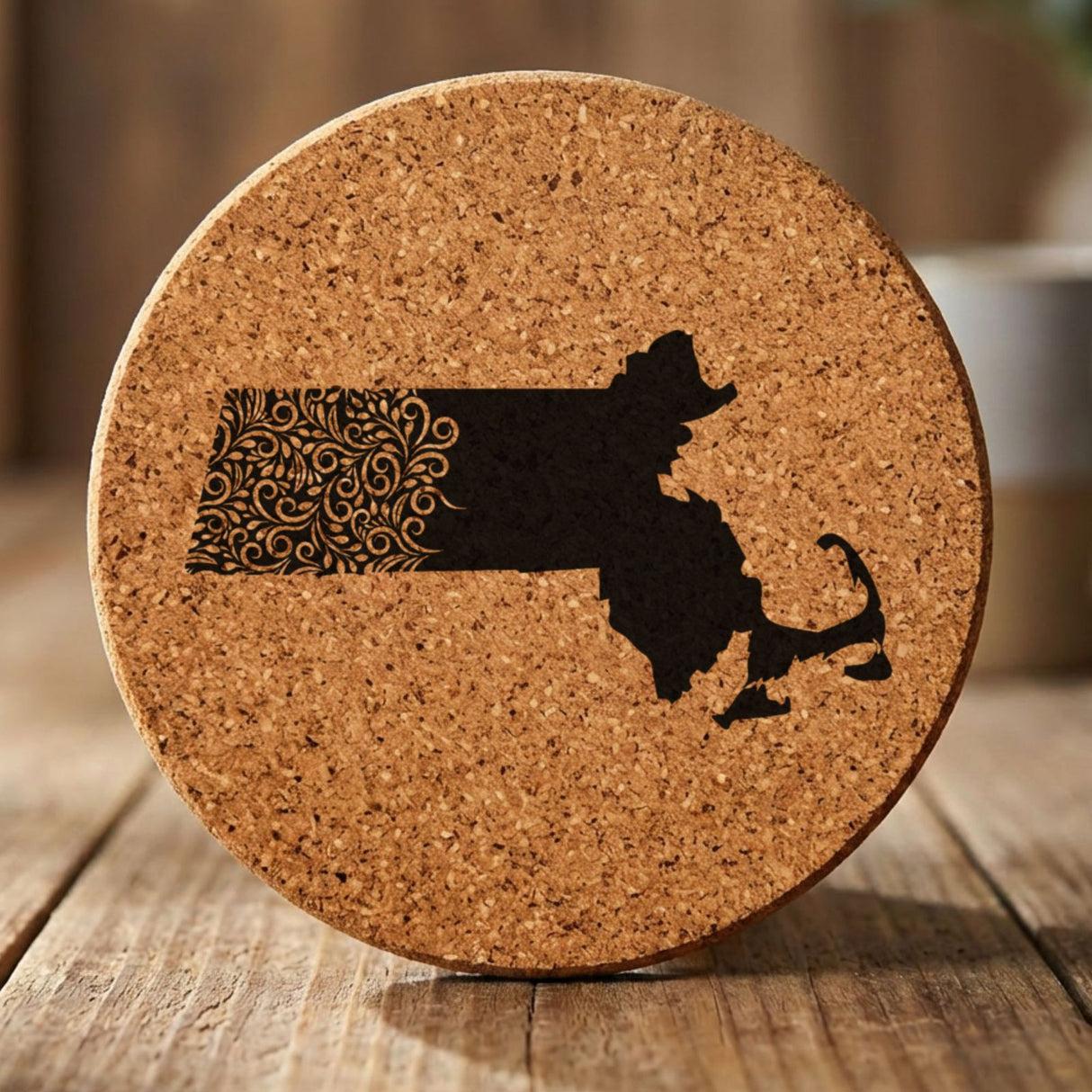 Massachusetts round cork coaster engraved with the state shape in ornate floral scrollwork