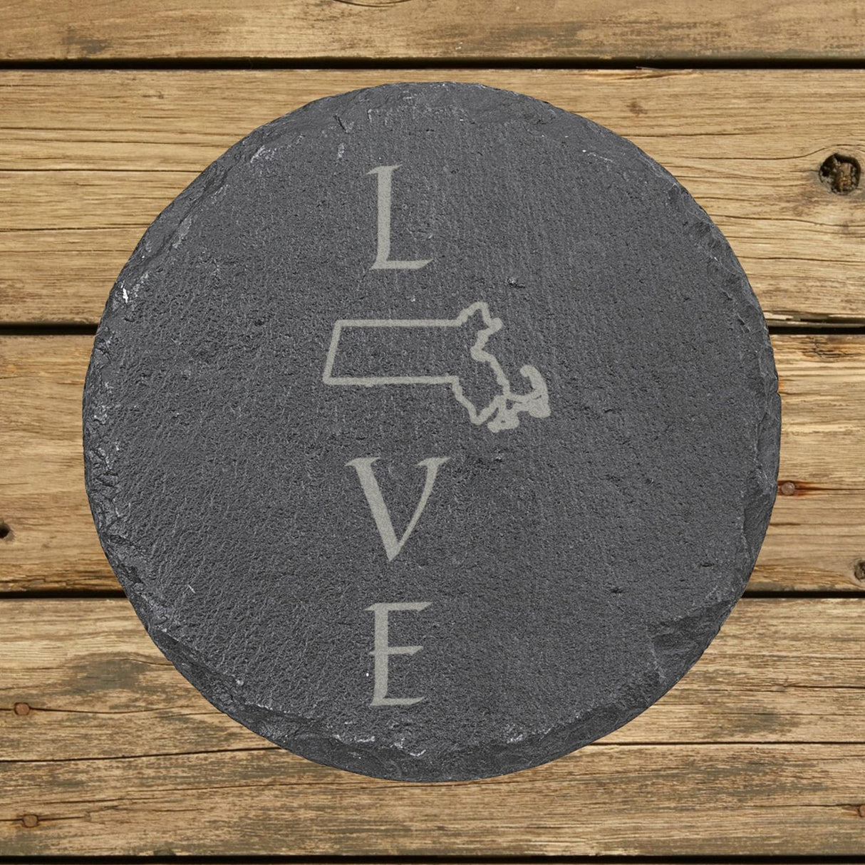 Massachusetts round slate coaster engraved with LOVE stacked vertically using the state as the letter O