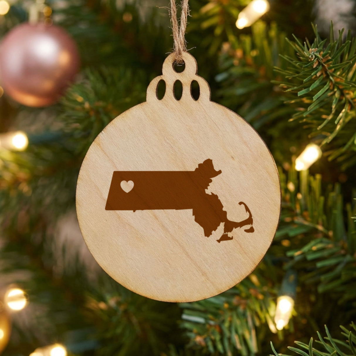 Massachusetts round wood Christmas ornament engraved with the state shape and a heart