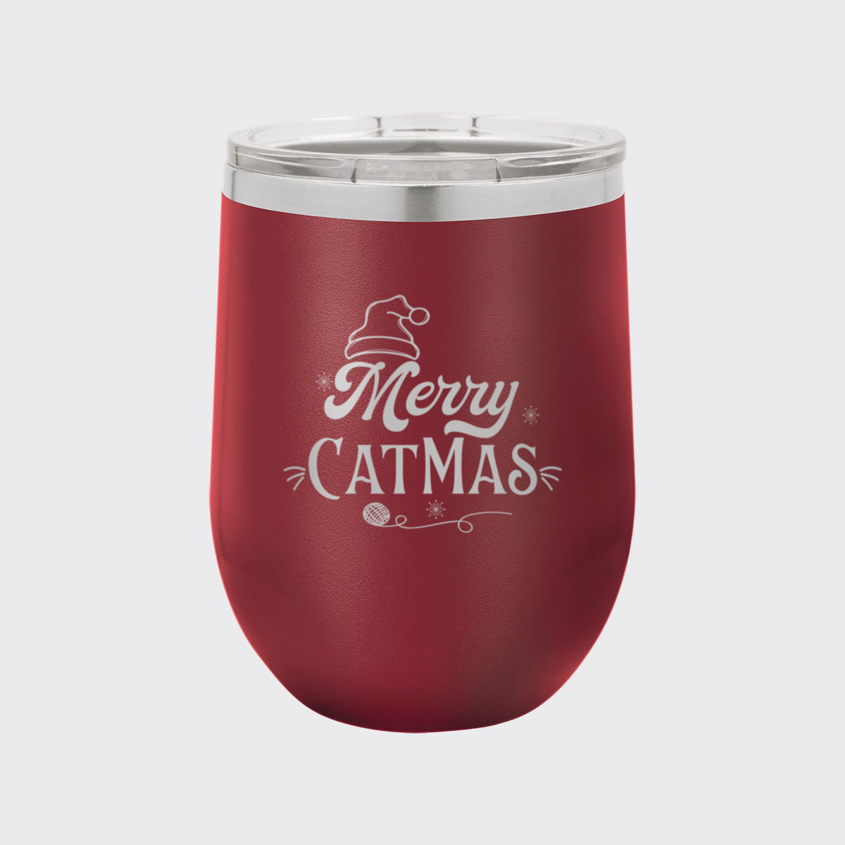 Maroon 12 oz stemless wine tumbler laser engraved with "Merry Catmas"