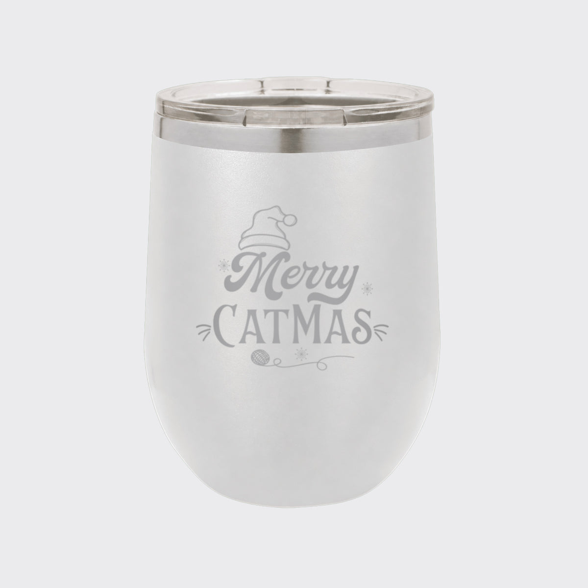 White 12 oz stemless wine tumbler laser engraved with "Merry Catmas"