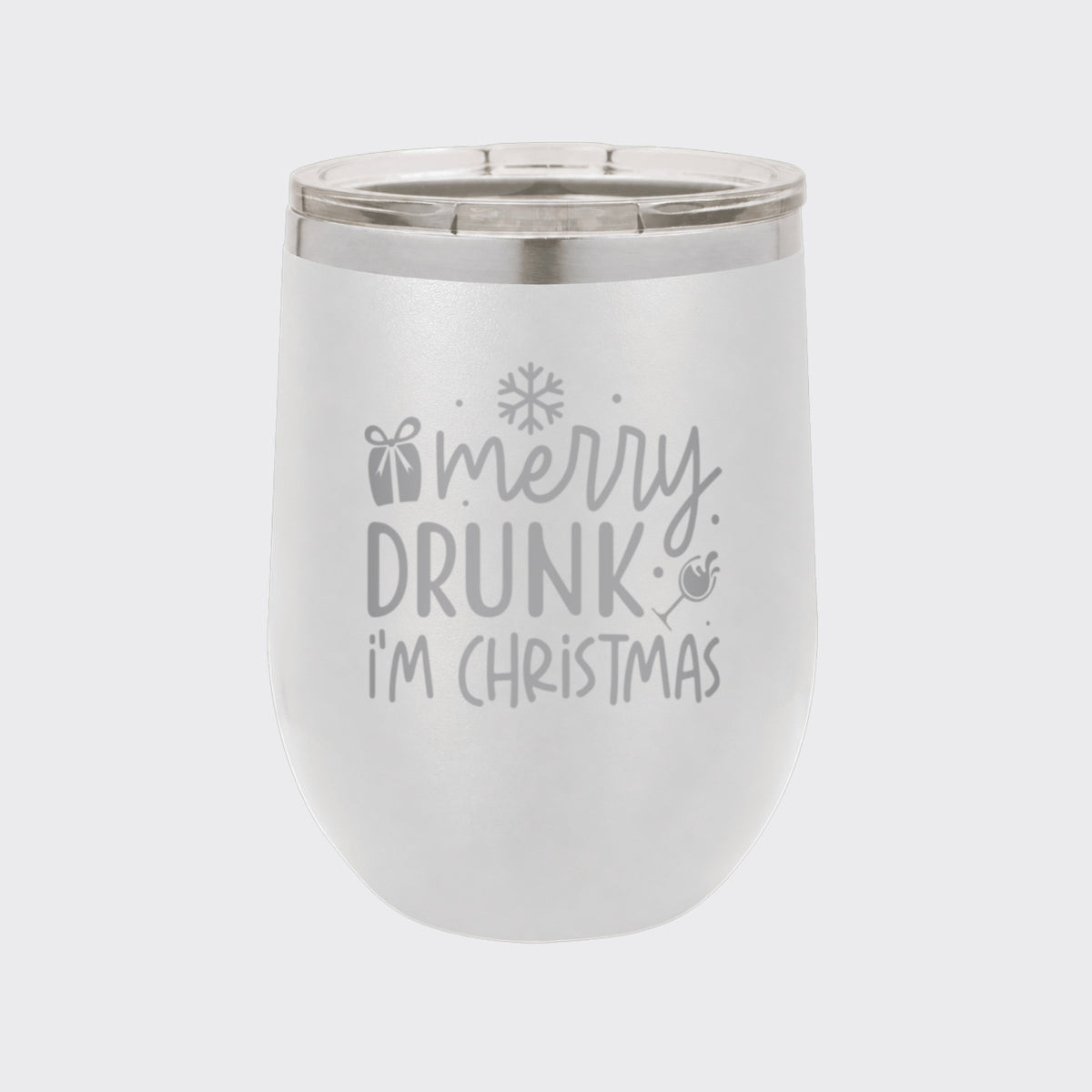 White 12 oz stemless wine tumbler laser engraved with "Merry Drunk, I'm Christmas"