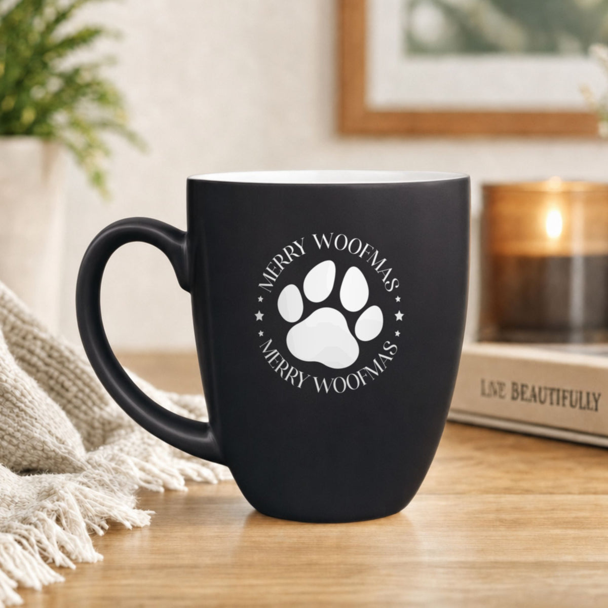 Black 16 oz ceramic coffee mug with "Merry Woofmas"