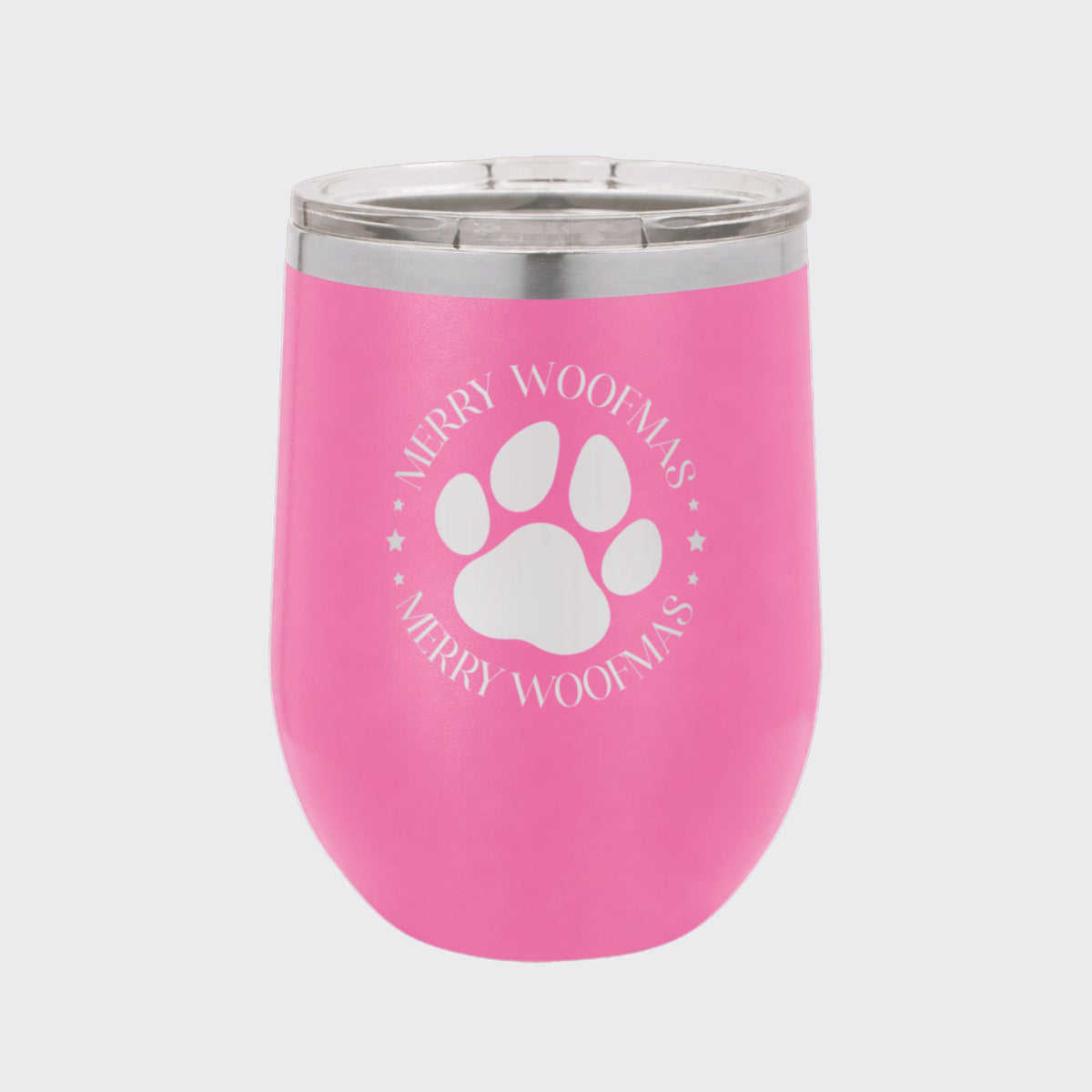 Pink 12 oz stemless wine tumbler laser engraved with "Merry Woofmas"