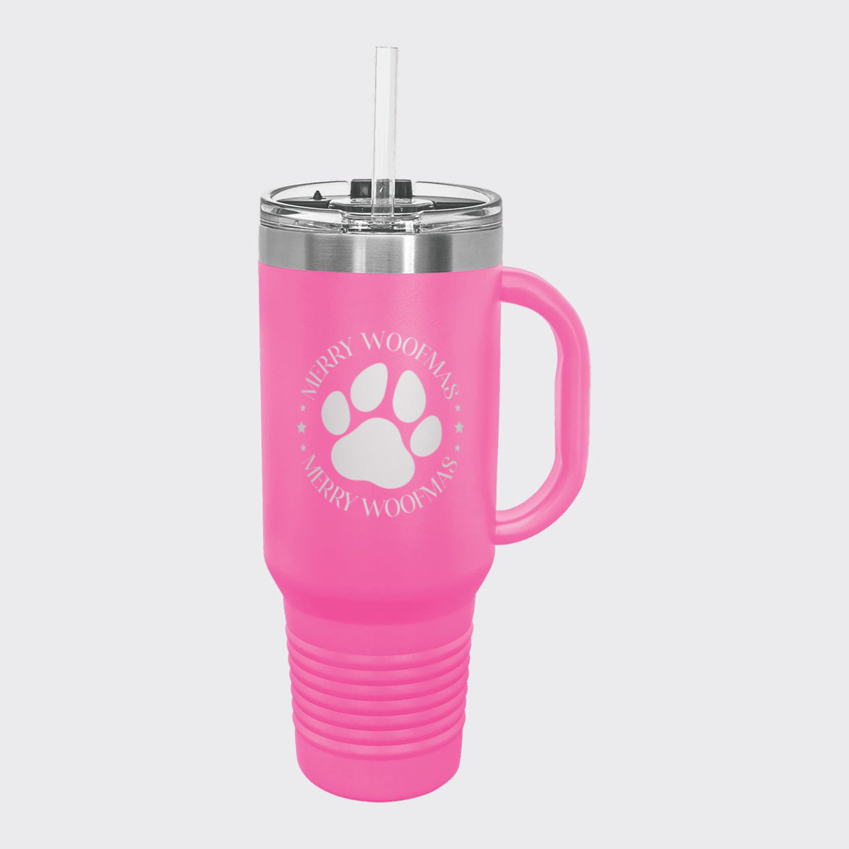 Pink 40 oz tumbler with handle and straw laser engraved with "Merry Woofmas"