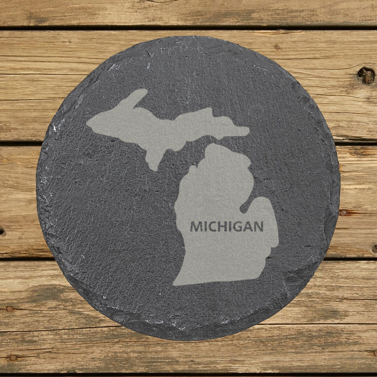 Michigan round slate coaster engraved with the state shape and MICHIGAN in bold lettering