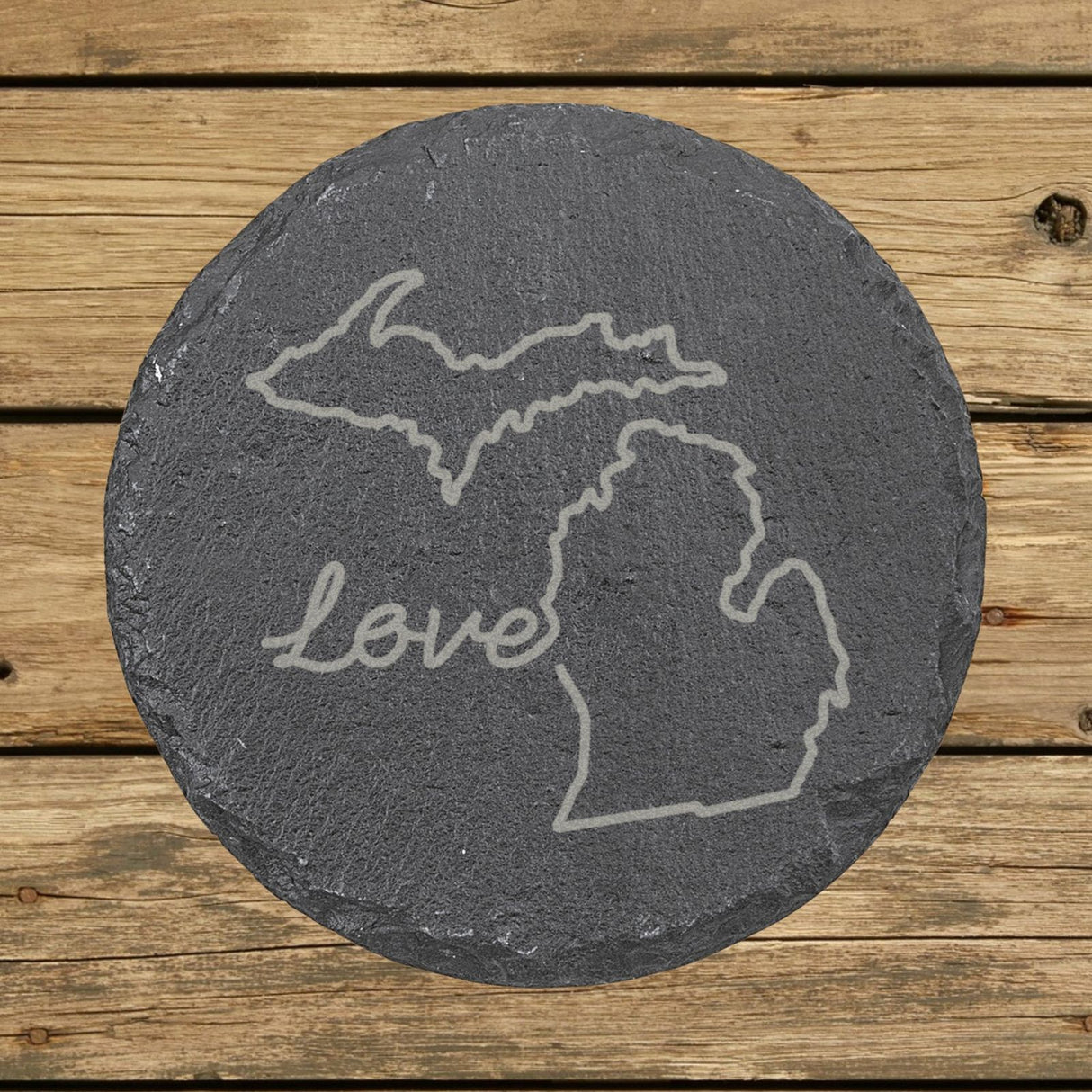Michigan round slate coaster engraved with a hand-drawn state outline and love in cursive