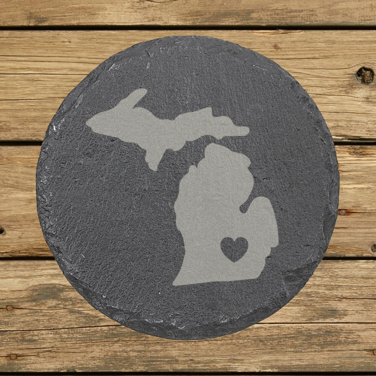 Michigan round slate coaster engraved with the state shape and a heart