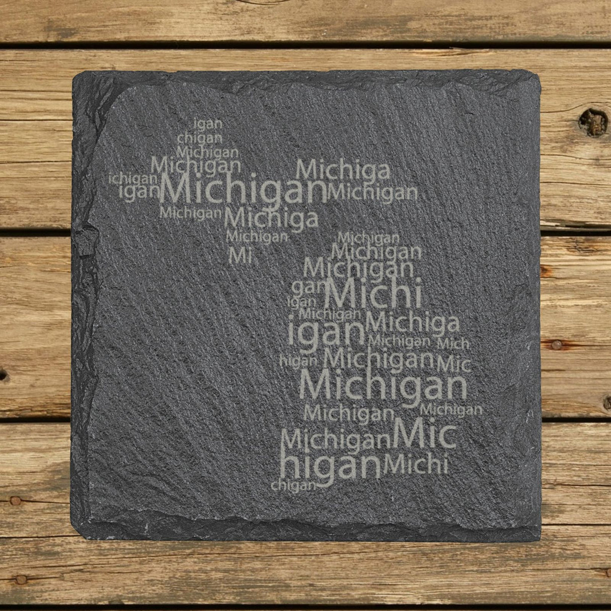 Michigan square slate coaster engraved with a word cloud of repeating Michigan text