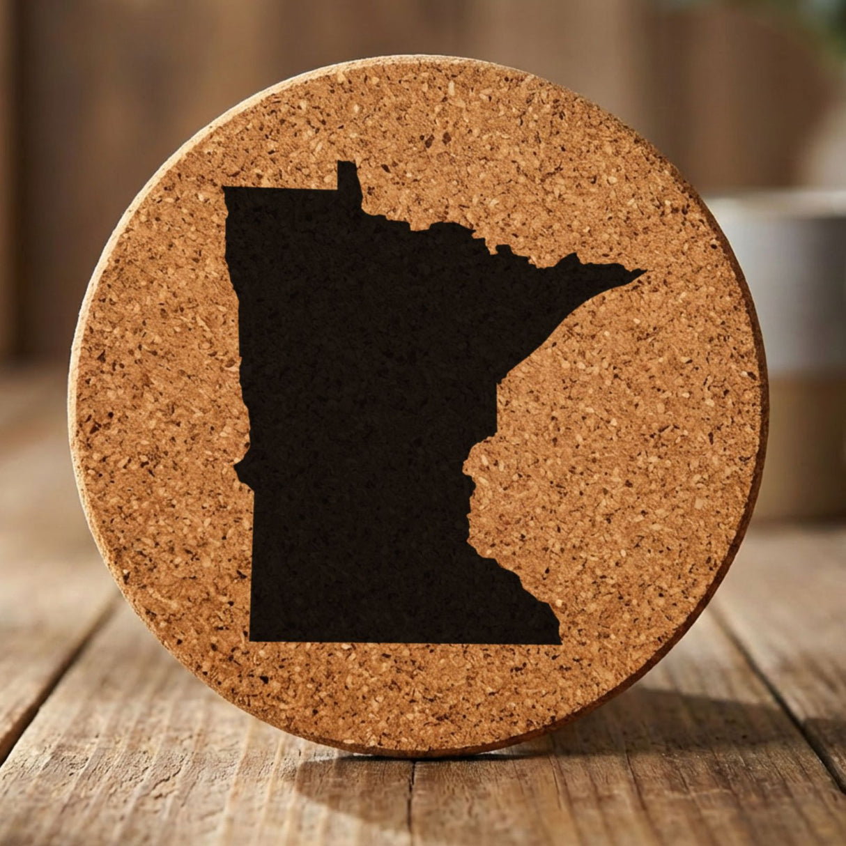 Minnesota round cork coaster with the full state shape engraved
