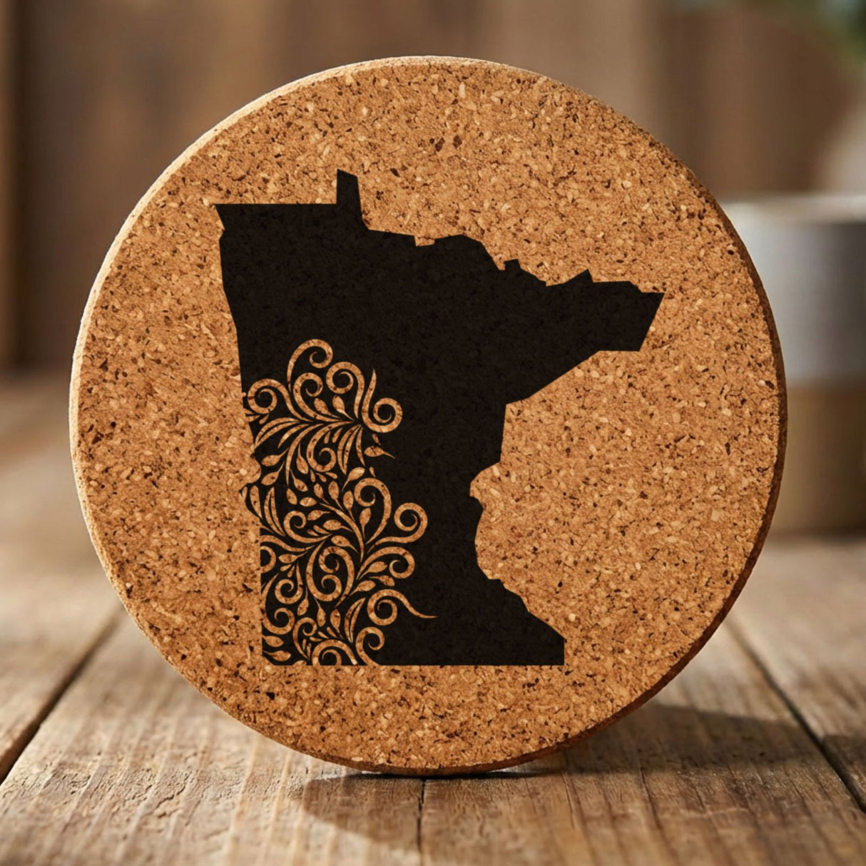 Minnesota round cork coaster engraved with the state shape in ornate floral scrollwork