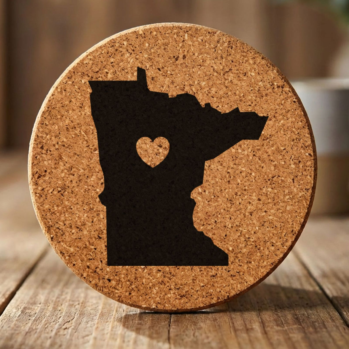 Minnesota round cork coaster engraved with the state shape and a heart