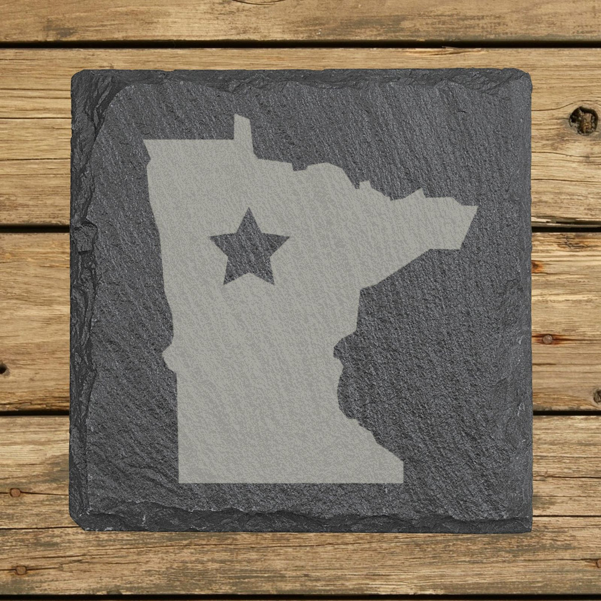 Minnesota square slate coaster engraved with the state shape and a star