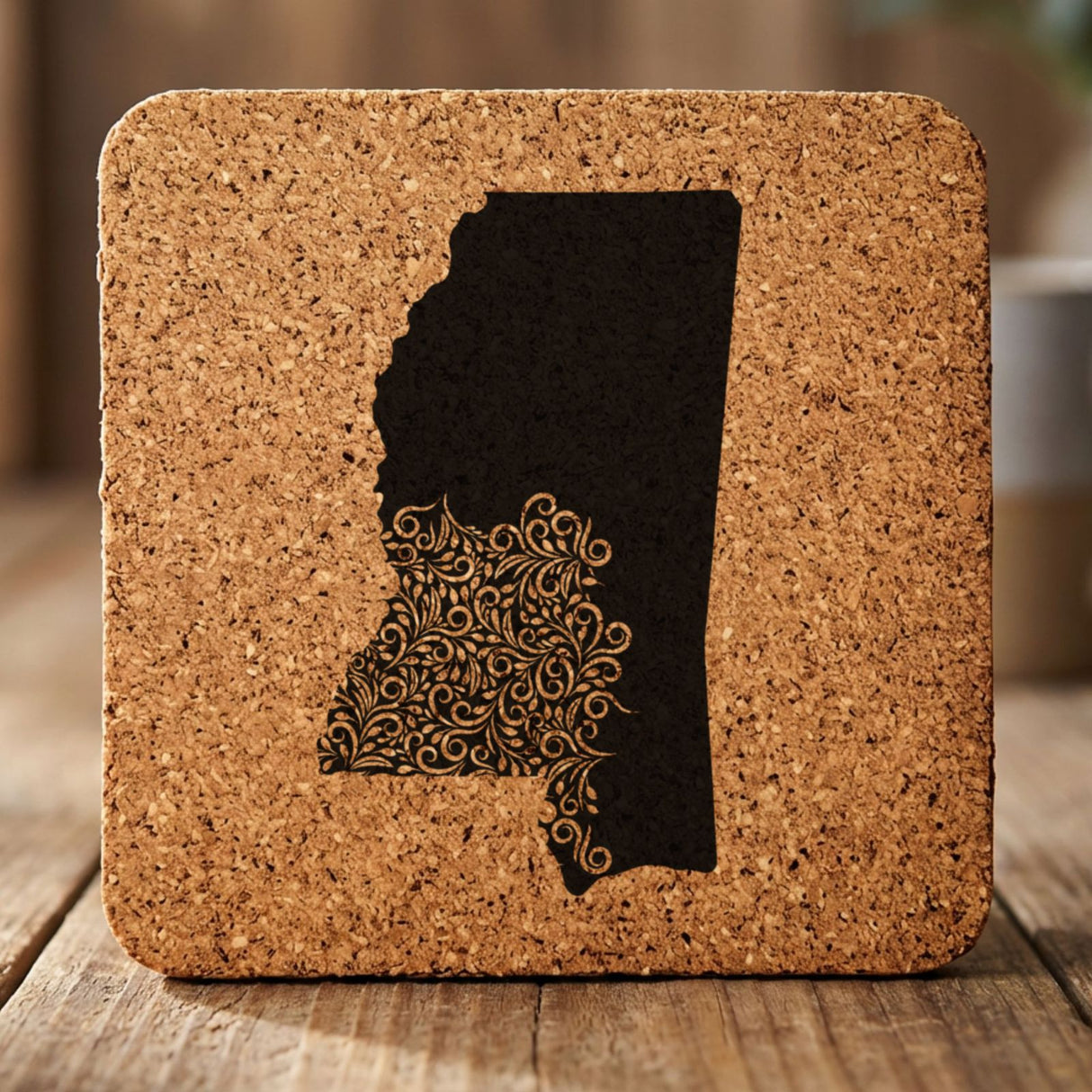 Mississippi square cork coaster engraved with the state shape in ornate floral scrollwork