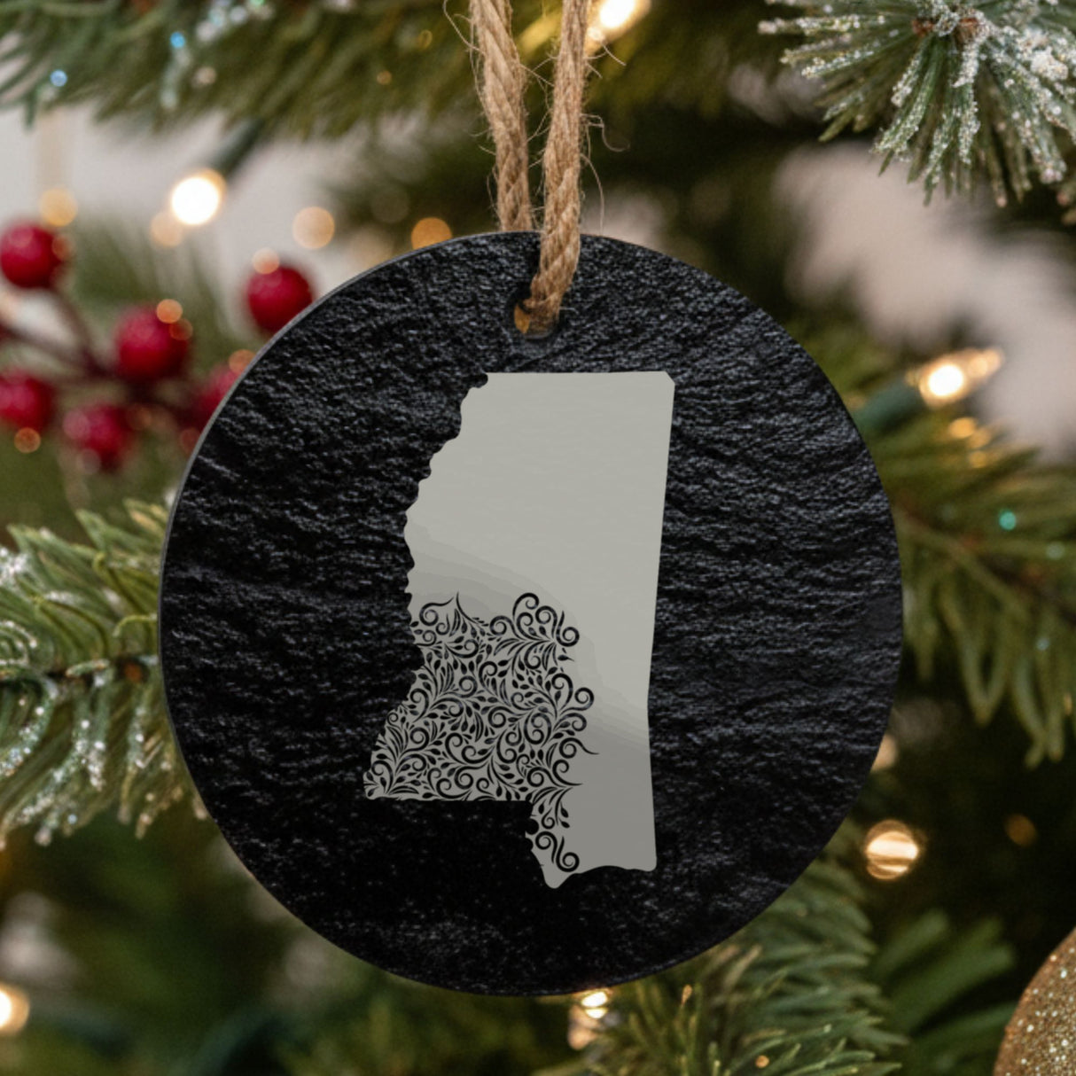 Mississippi round slate Christmas ornament engraved with the state shape in ornate floral scrollwork