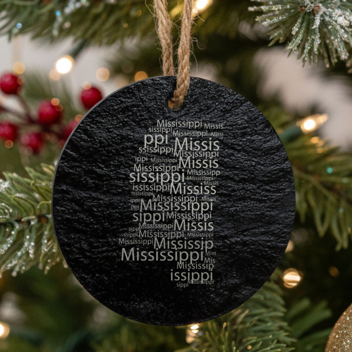Mississippi round slate Christmas ornament engraved with a word cloud of repeating Mississippi text