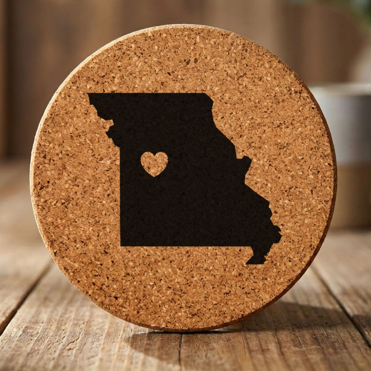 Missouri round cork coaster engraved with the state shape and a heart