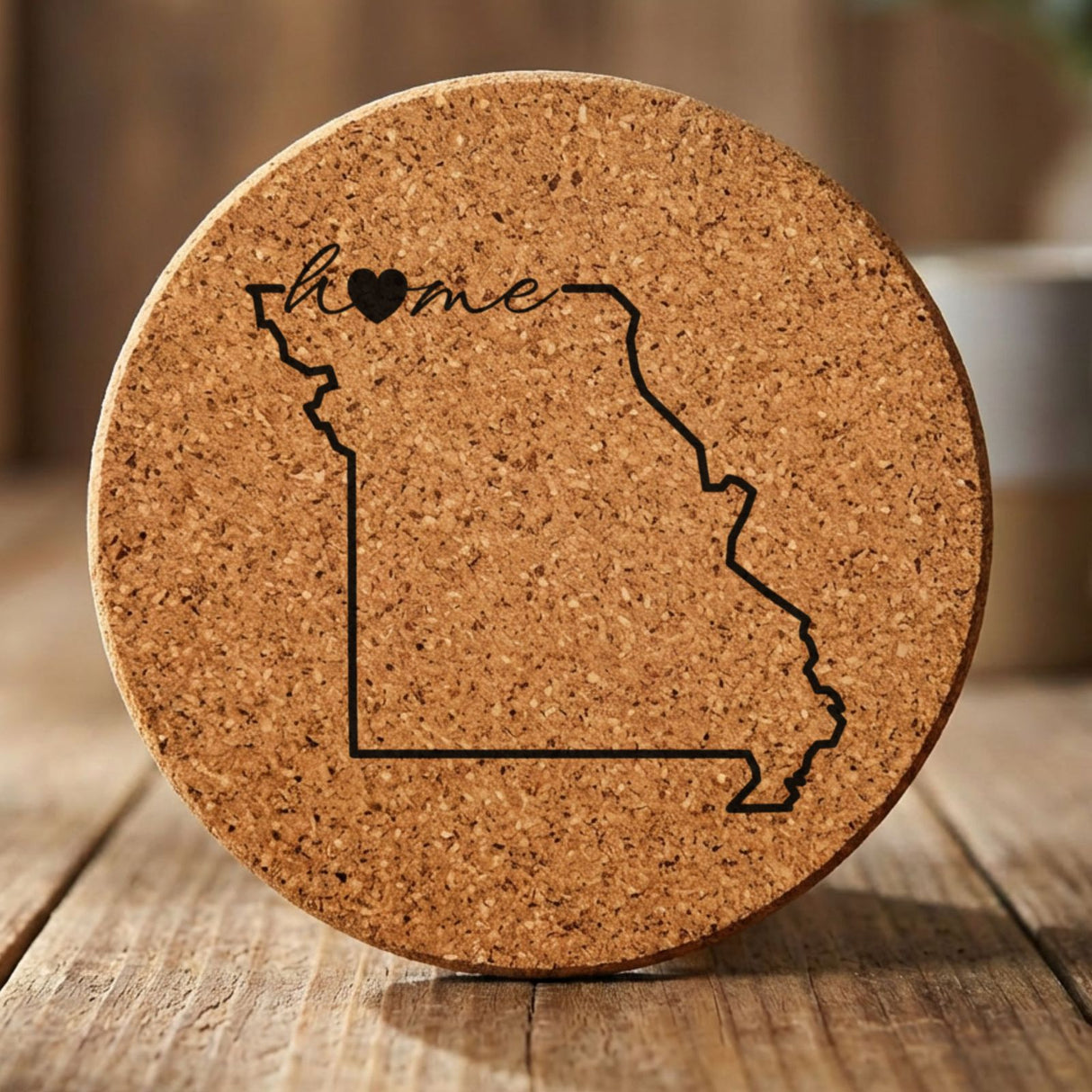 Missouri round cork coaster engraved with the state outline and home in script with a heart