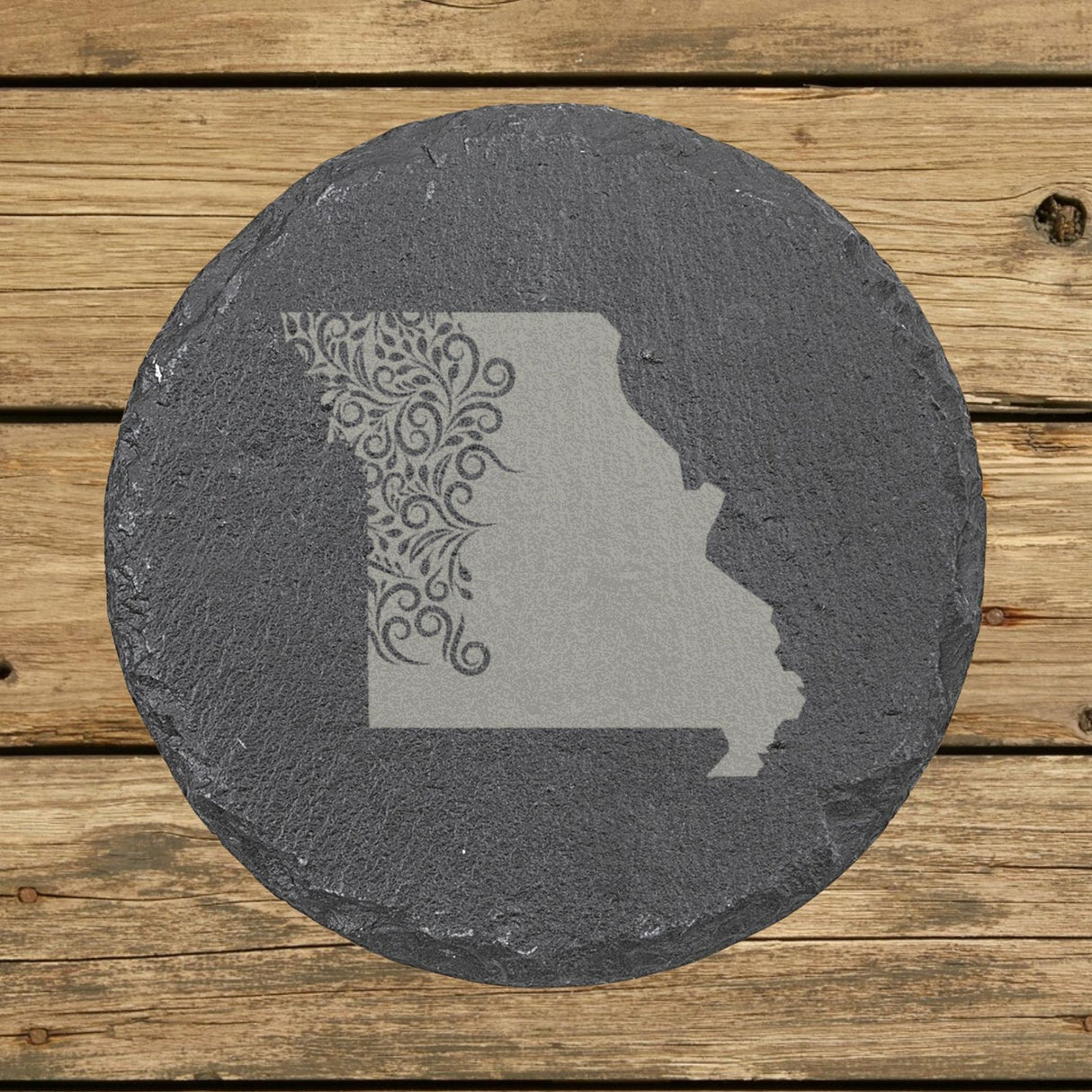 Missouri round slate coaster engraved with the state shape in ornate floral scrollwork