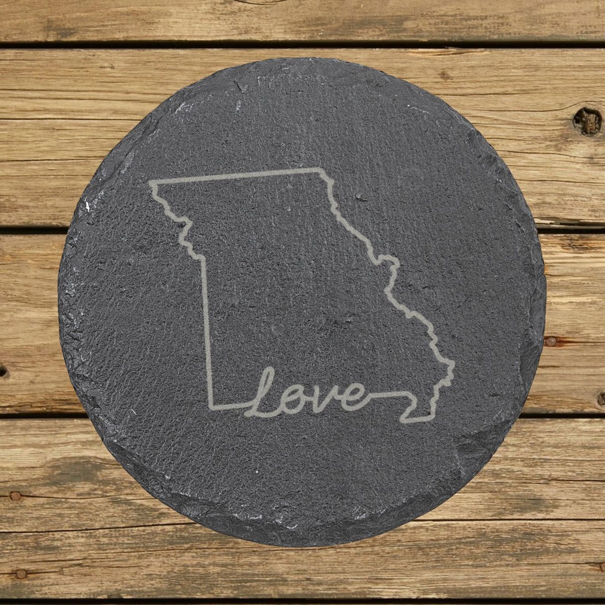 Missouri round slate coaster engraved with a hand-drawn state outline and love in cursive