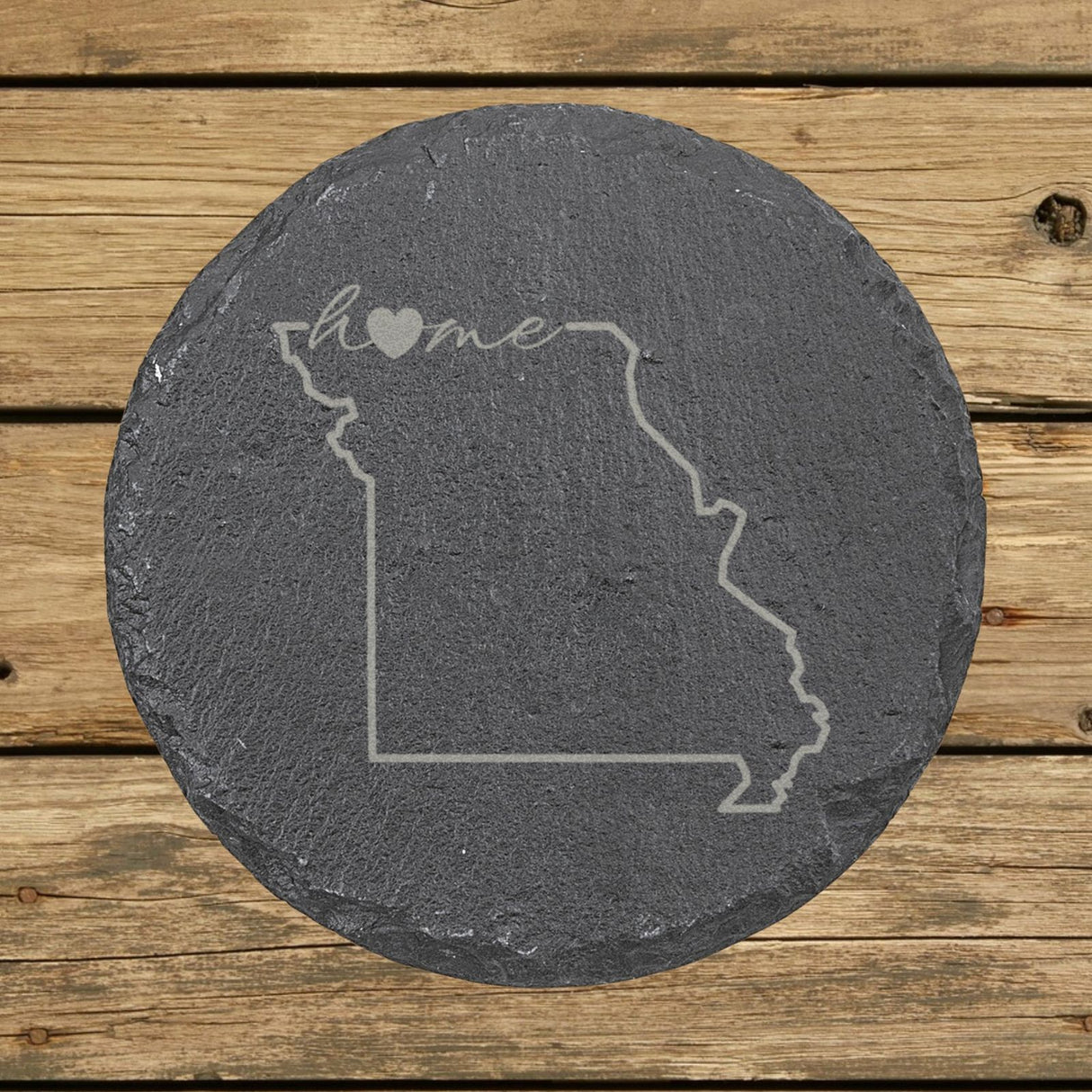 Missouri round slate coaster engraved with the state outline and home in script with a heart