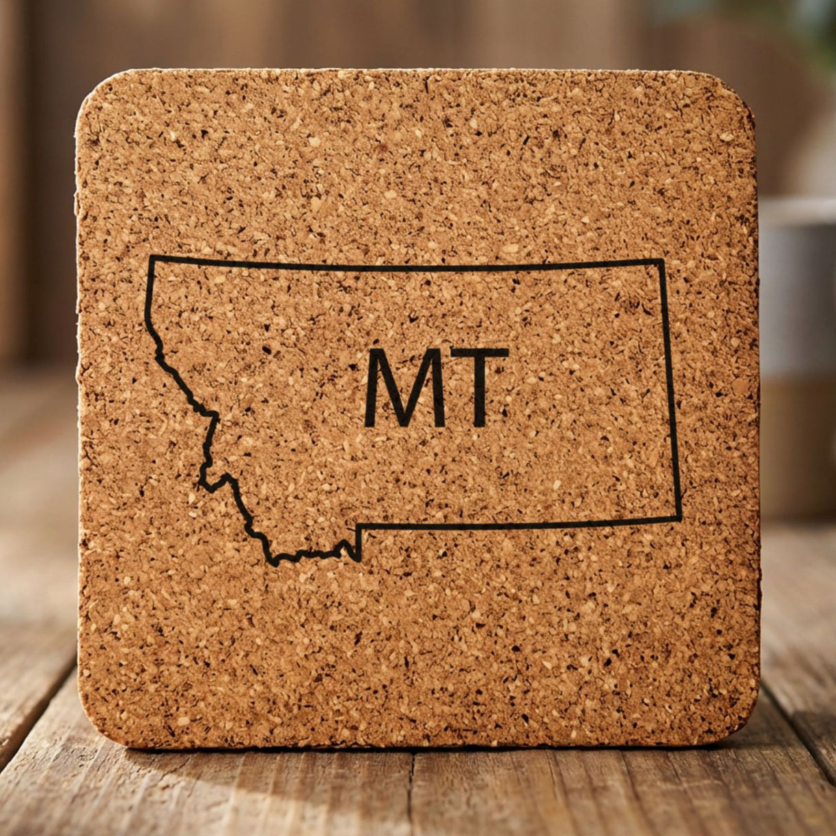 Montana square cork coaster engraved with the state outline and MT initials