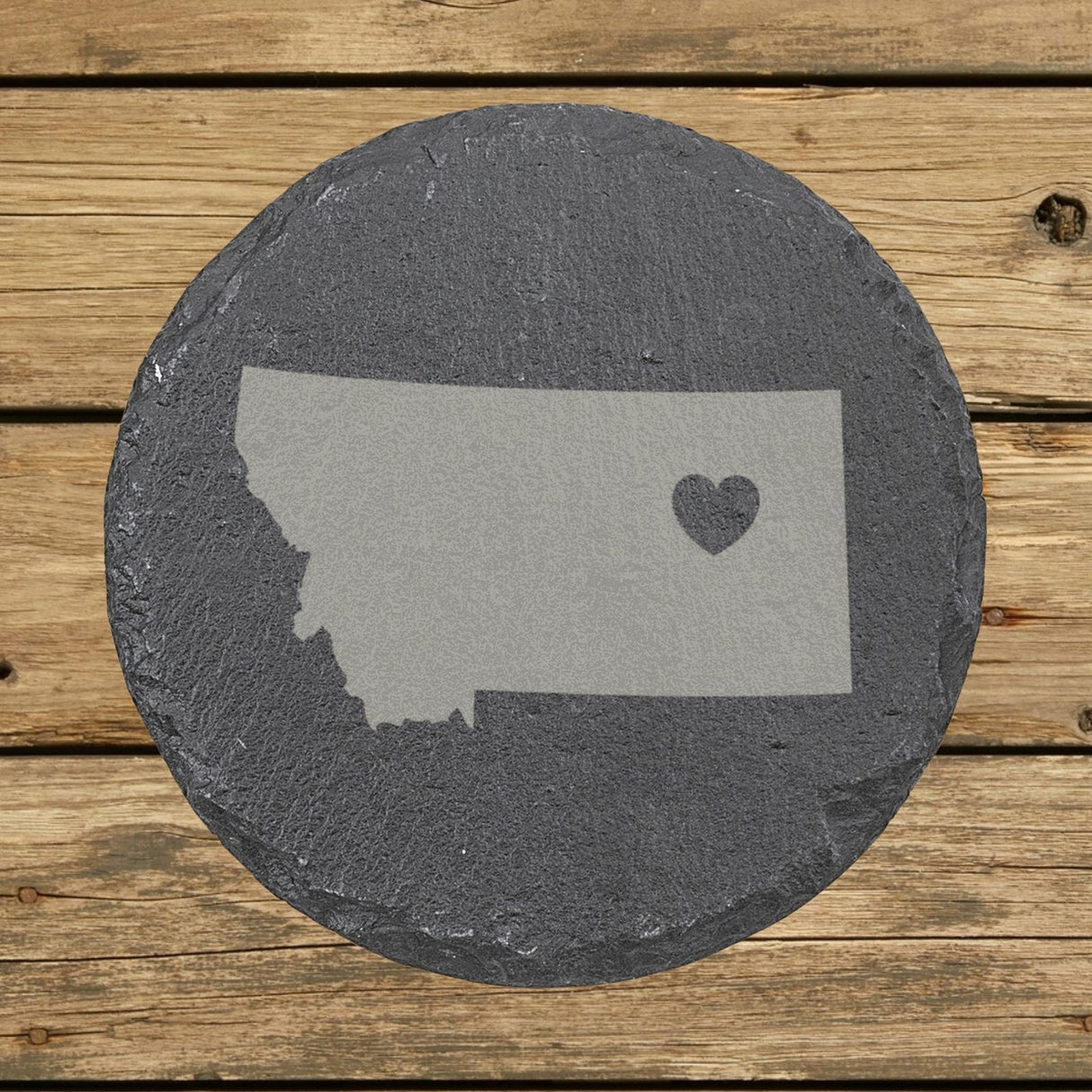 Montana round slate coaster engraved with the state shape and a heart