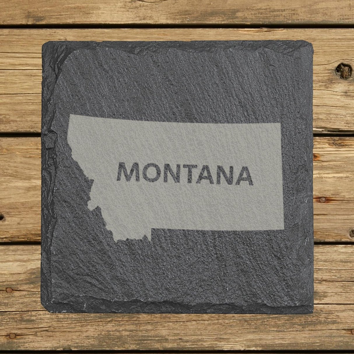 Montana square slate coaster engraved with the state shape and MONTANA in bold lettering
