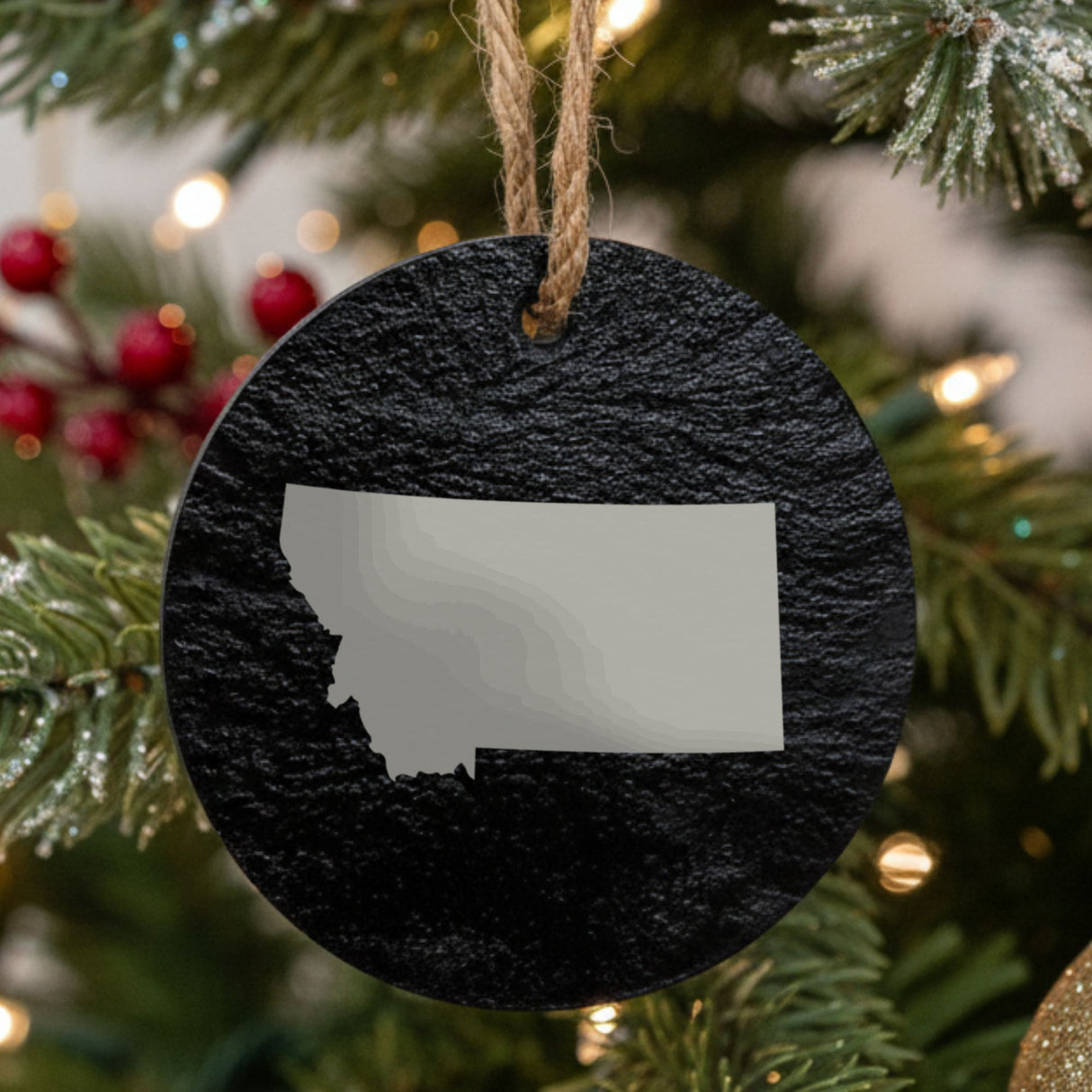 Montana round slate Christmas ornament with the full state shape engraved