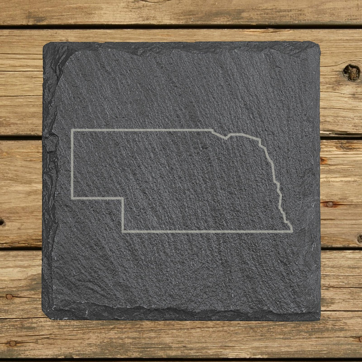 Nebraska square slate coaster engraved with a clean state outline