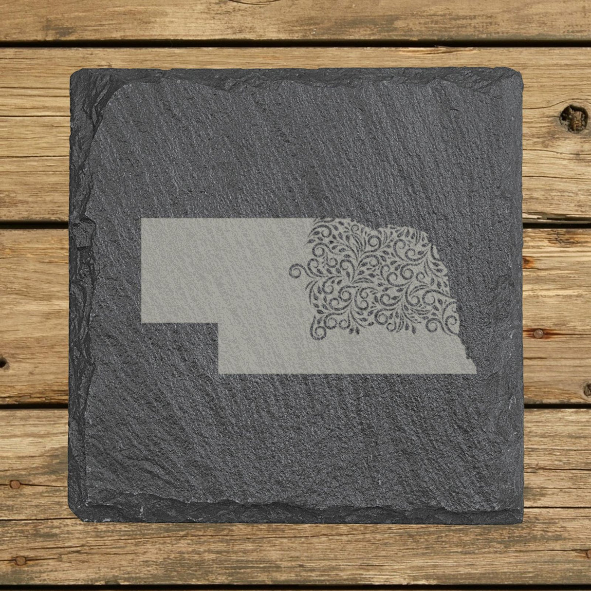 Nebraska square slate coaster engraved with the state shape in ornate floral scrollwork