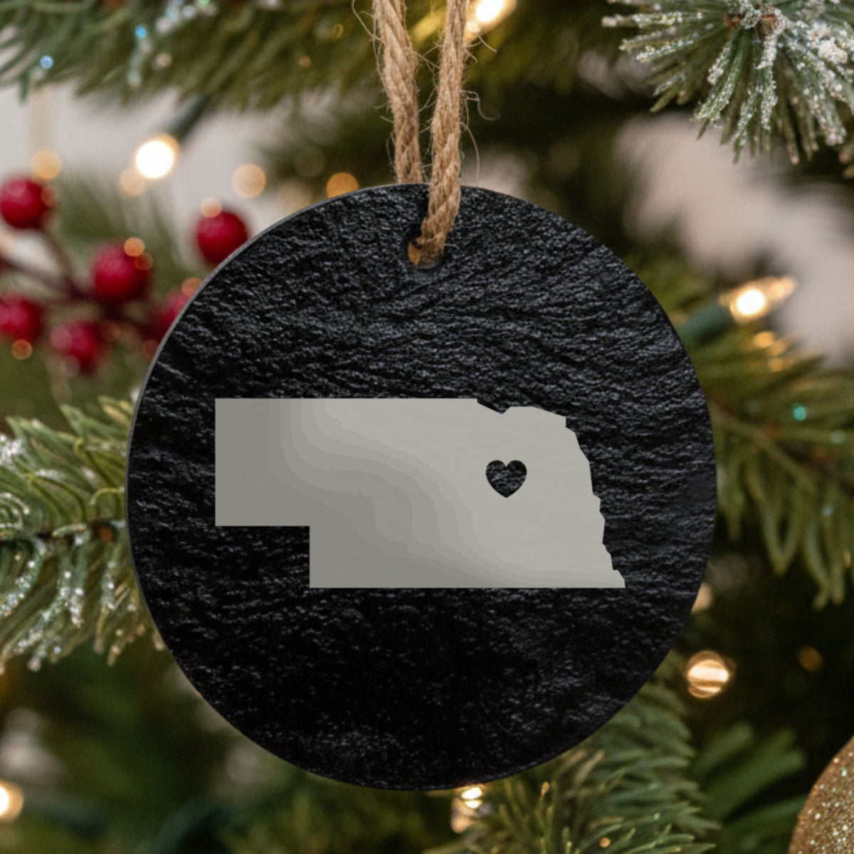 Nebraska round slate Christmas ornament engraved with the state shape and a heart