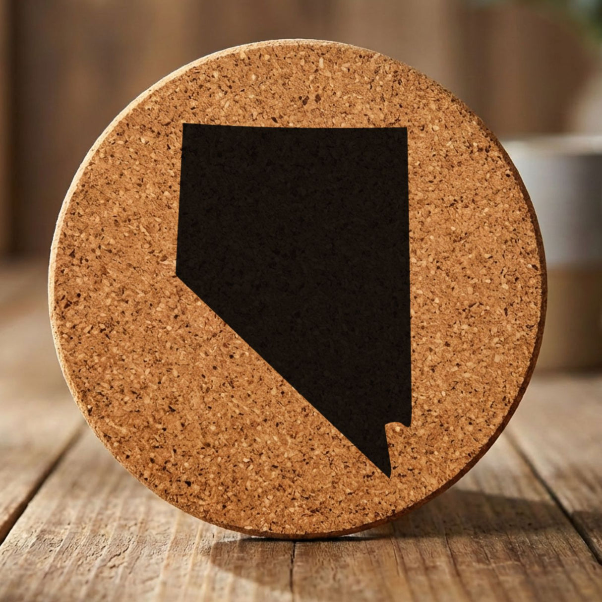 Nevada round cork coaster with the full state shape engraved
