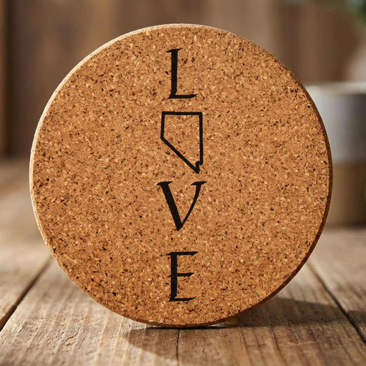 Nevada round cork coaster engraved with LOVE stacked vertically using the state as the letter O