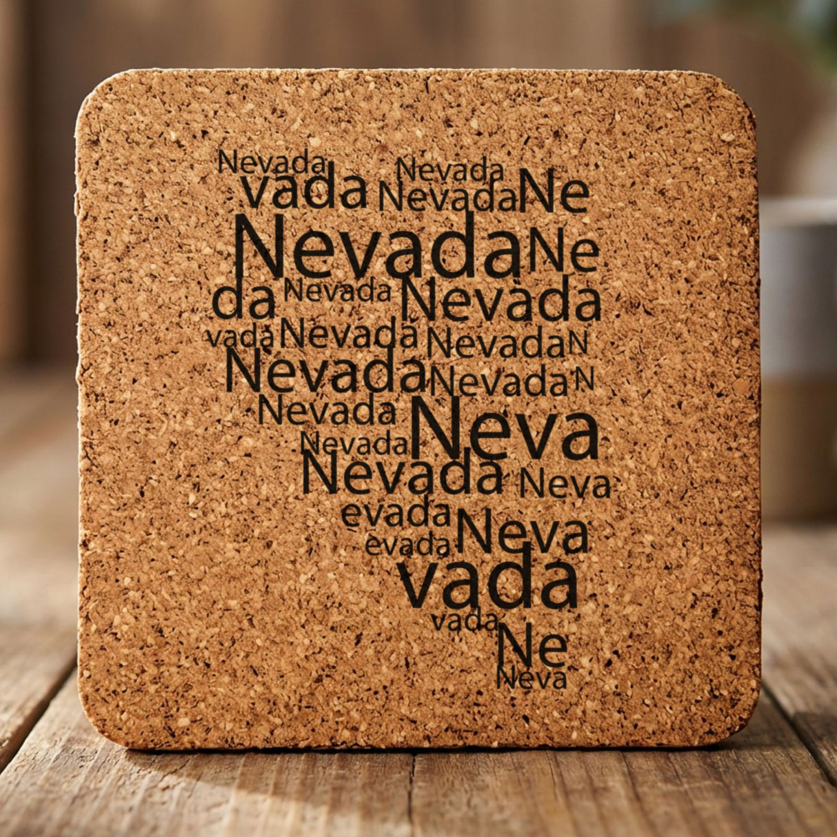 Nevada square cork coaster engraved with a word cloud of repeating Nevada text