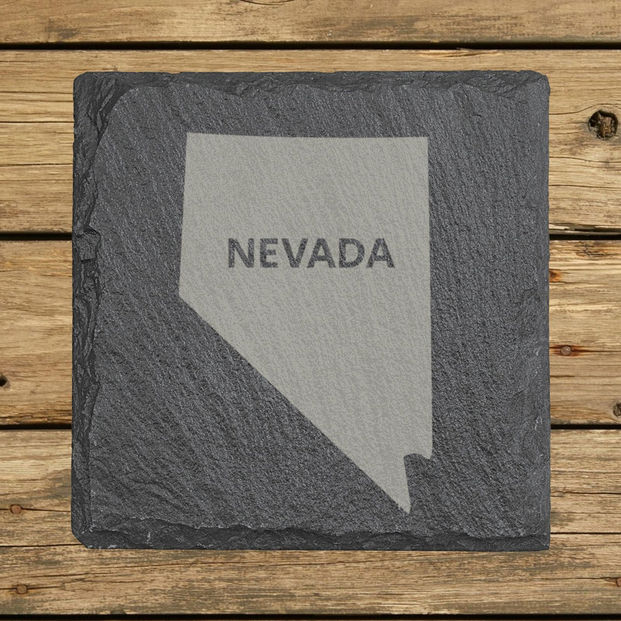 Nevada square slate coaster engraved with the state shape and NEVADA in bold lettering