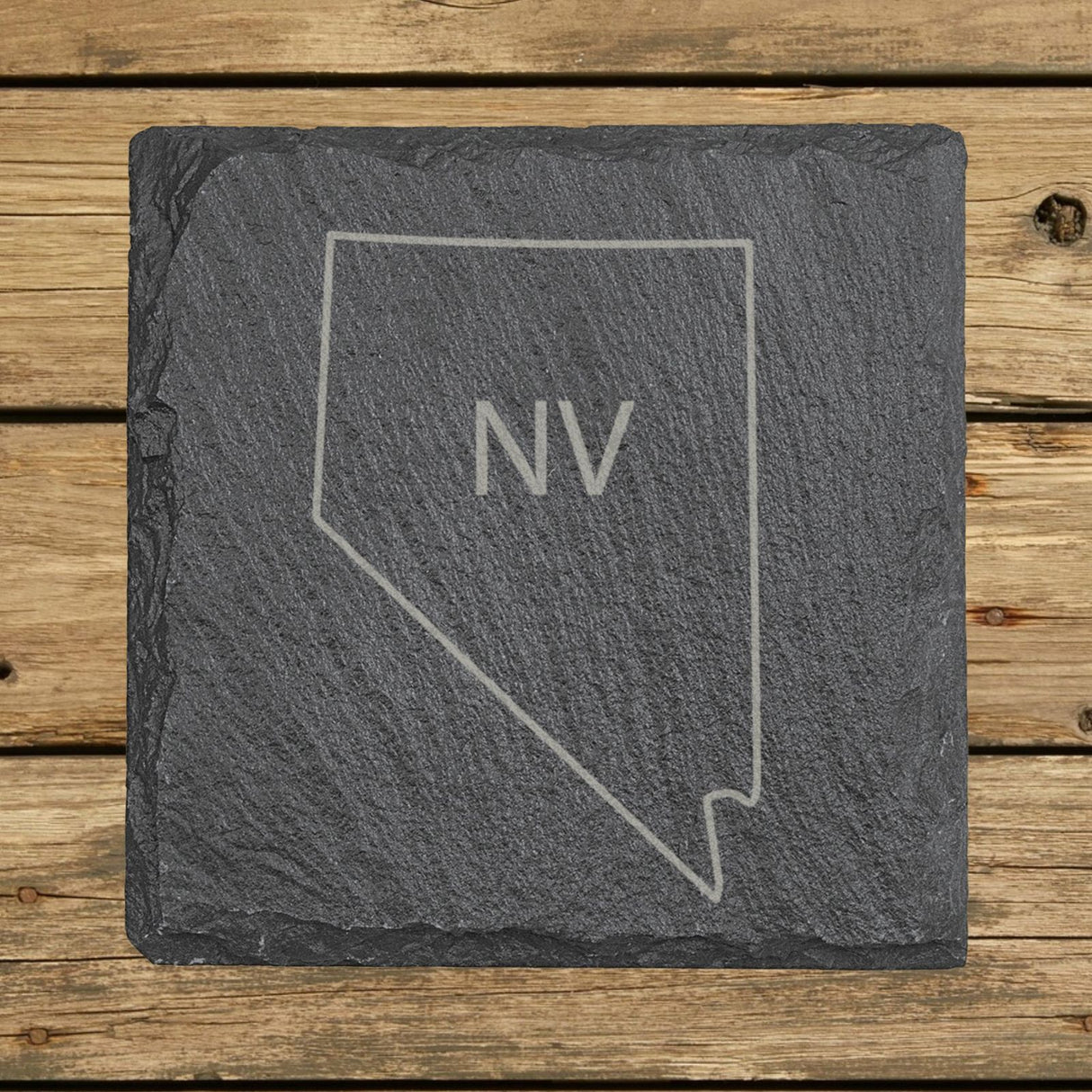 Nevada square slate coaster engraved with the state outline and NV initials