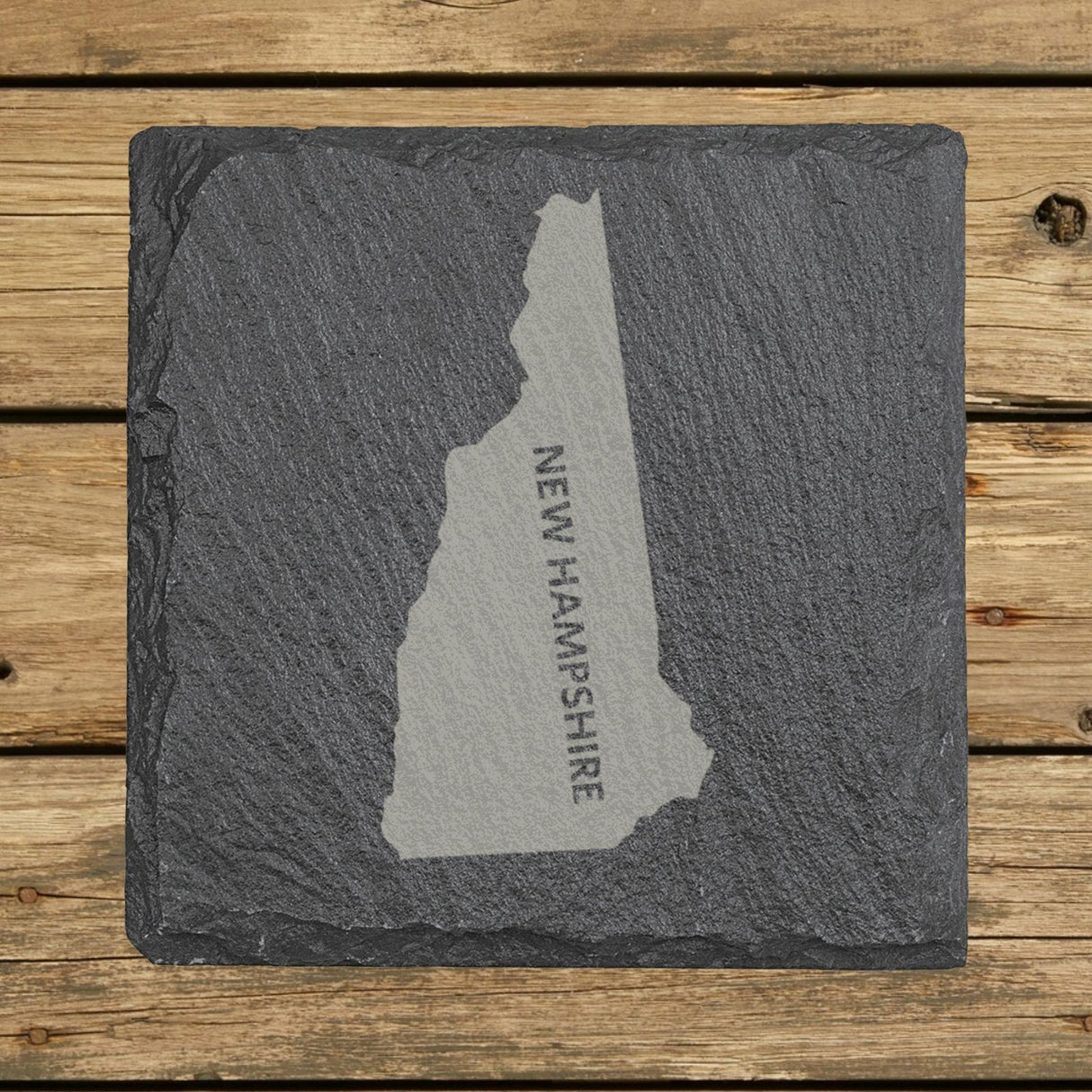 New Hampshire square slate coaster with the engraved state shape and NEW HAMPSHIRE running vertically