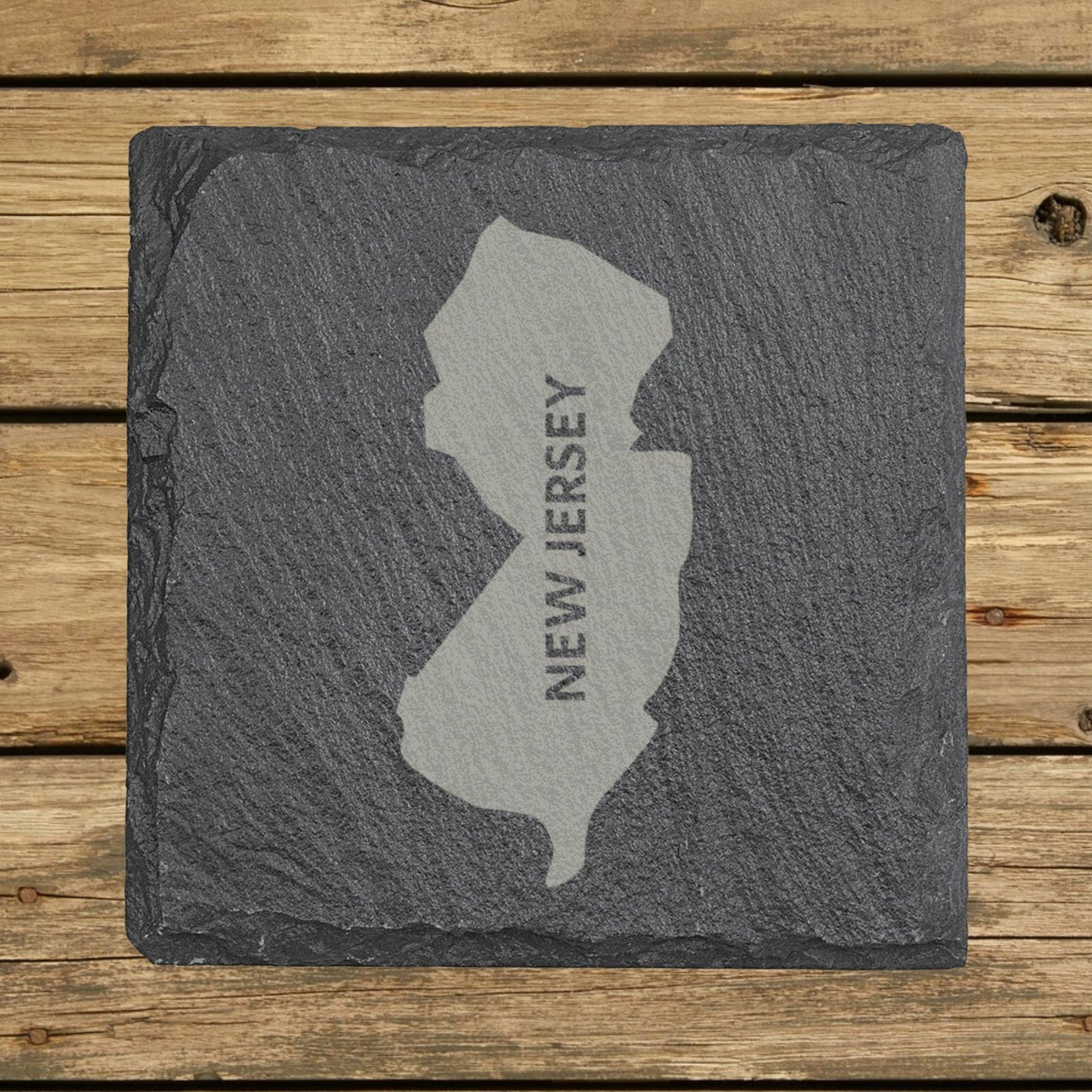 New Jersey square slate coaster with the engraved state shape and NEW JERSEY running vertically