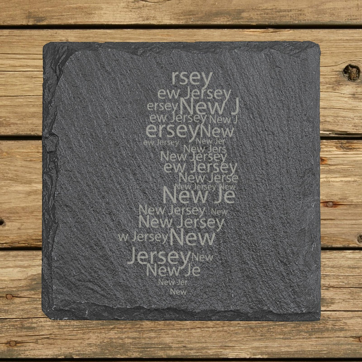 New Jersey square slate coaster engraved with a word cloud of repeating New Jersey text