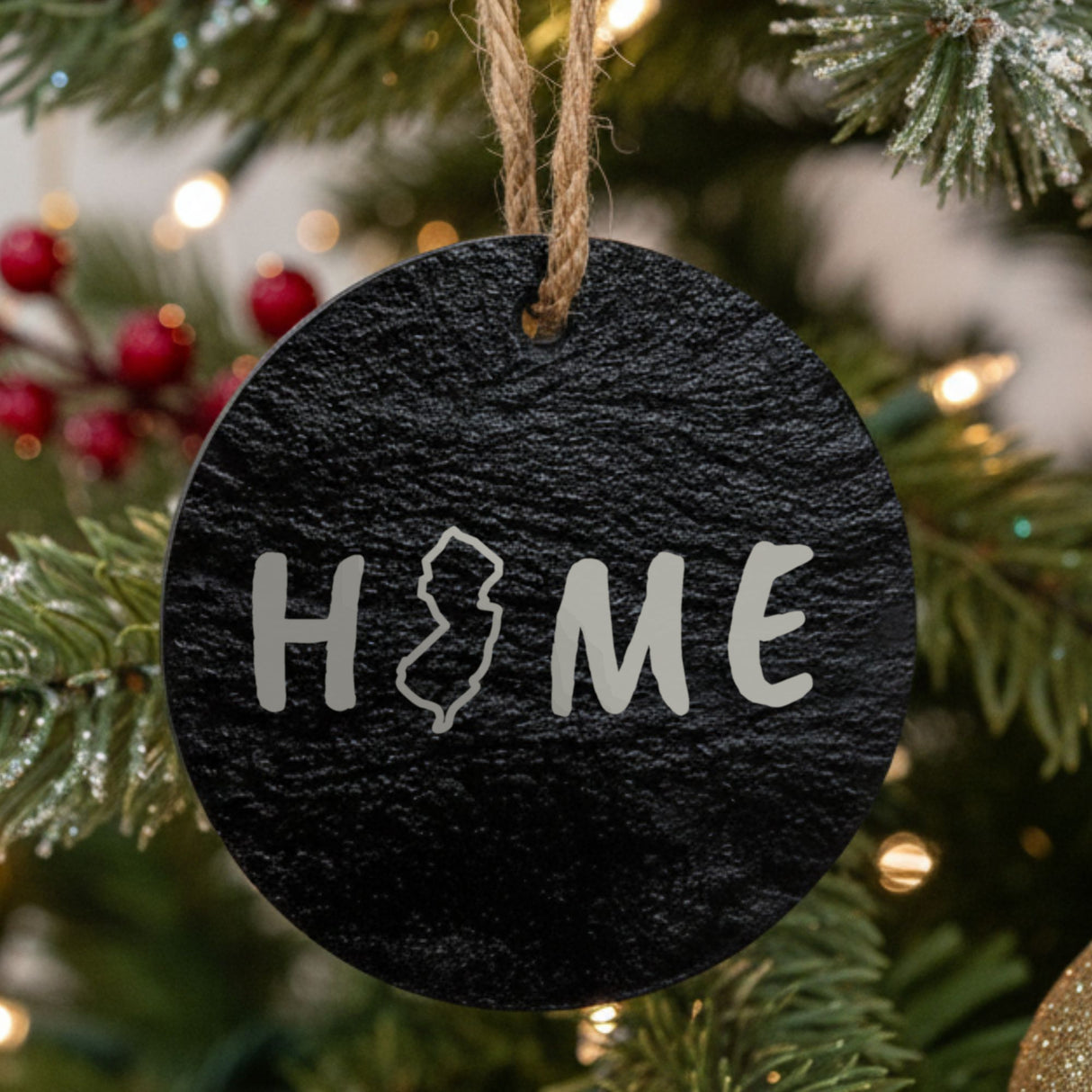 New Jersey round slate Christmas ornament engraved with HOME using the state outline as the letter O
