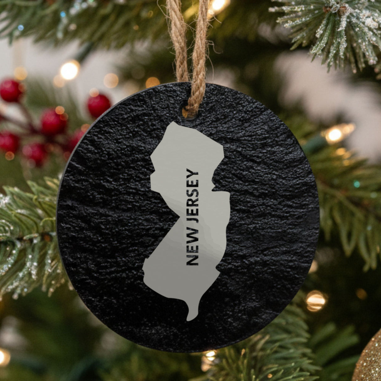 New Jersey round slate Christmas ornament engraved with the state shape and NEW JERSEY in vertical lettering