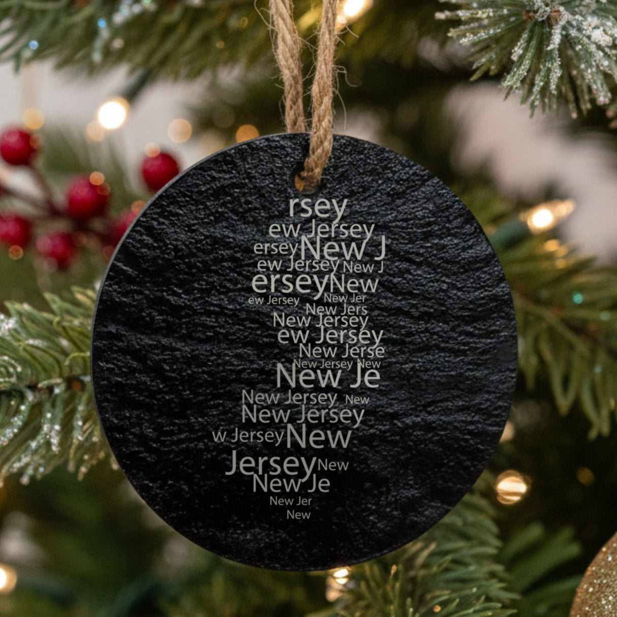 New Jersey round slate Christmas ornament engraved with a word cloud of repeating New Jersey text