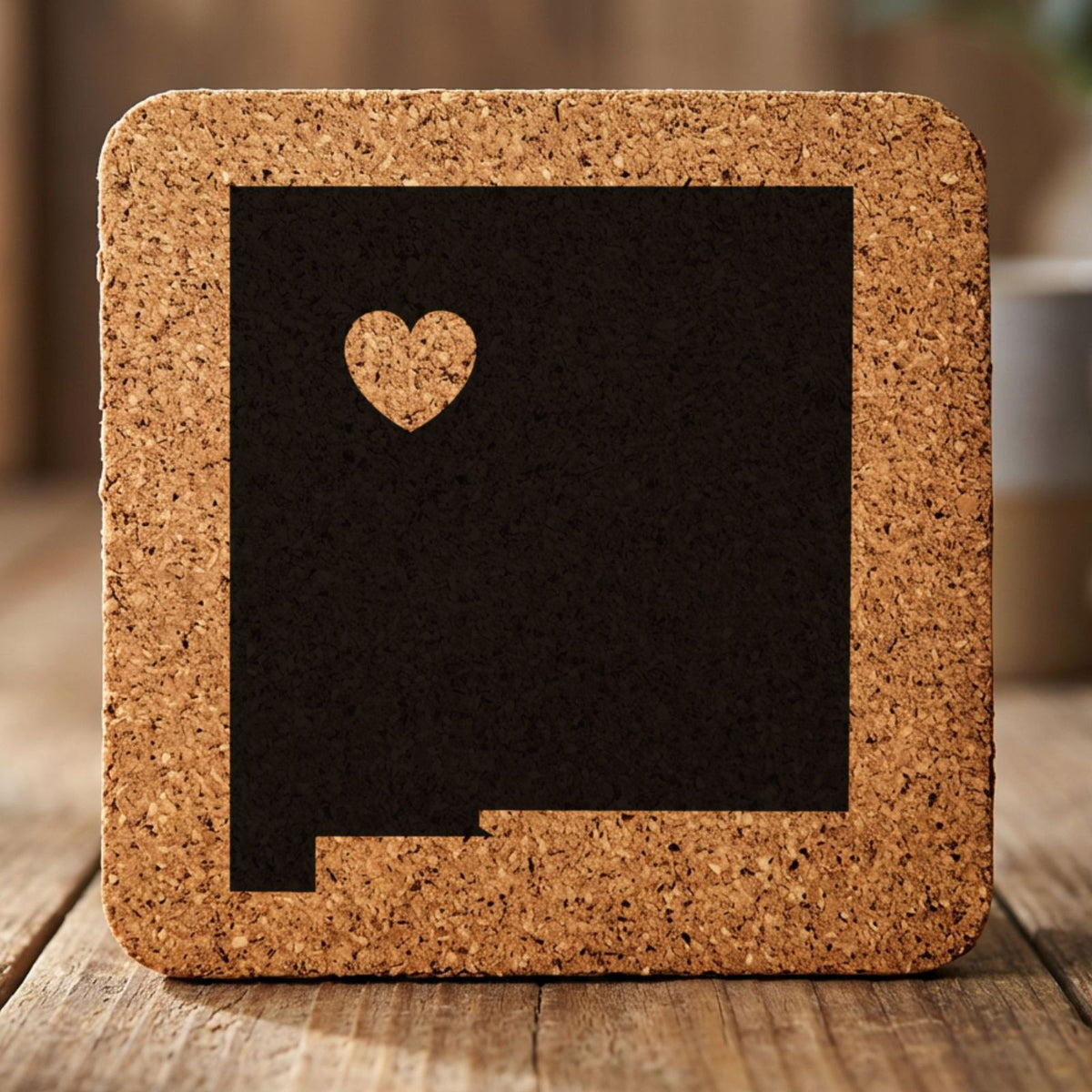 New Mexico square cork coaster engraved with the state shape and a heart