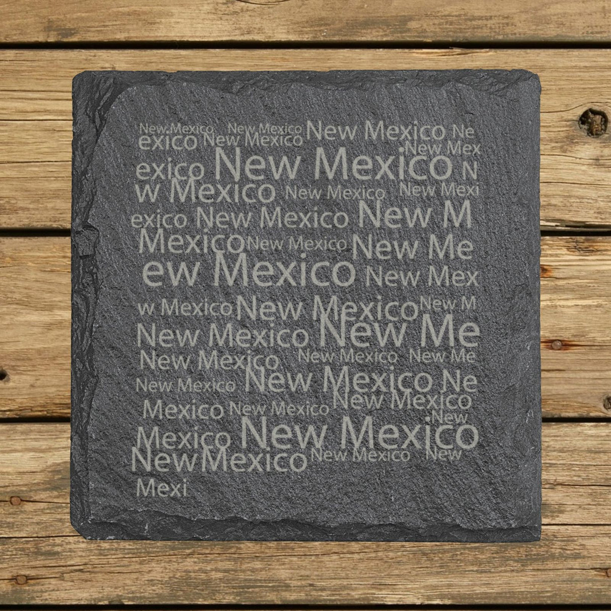 New Mexico square slate coaster engraved with a word cloud of repeating New Mexico text