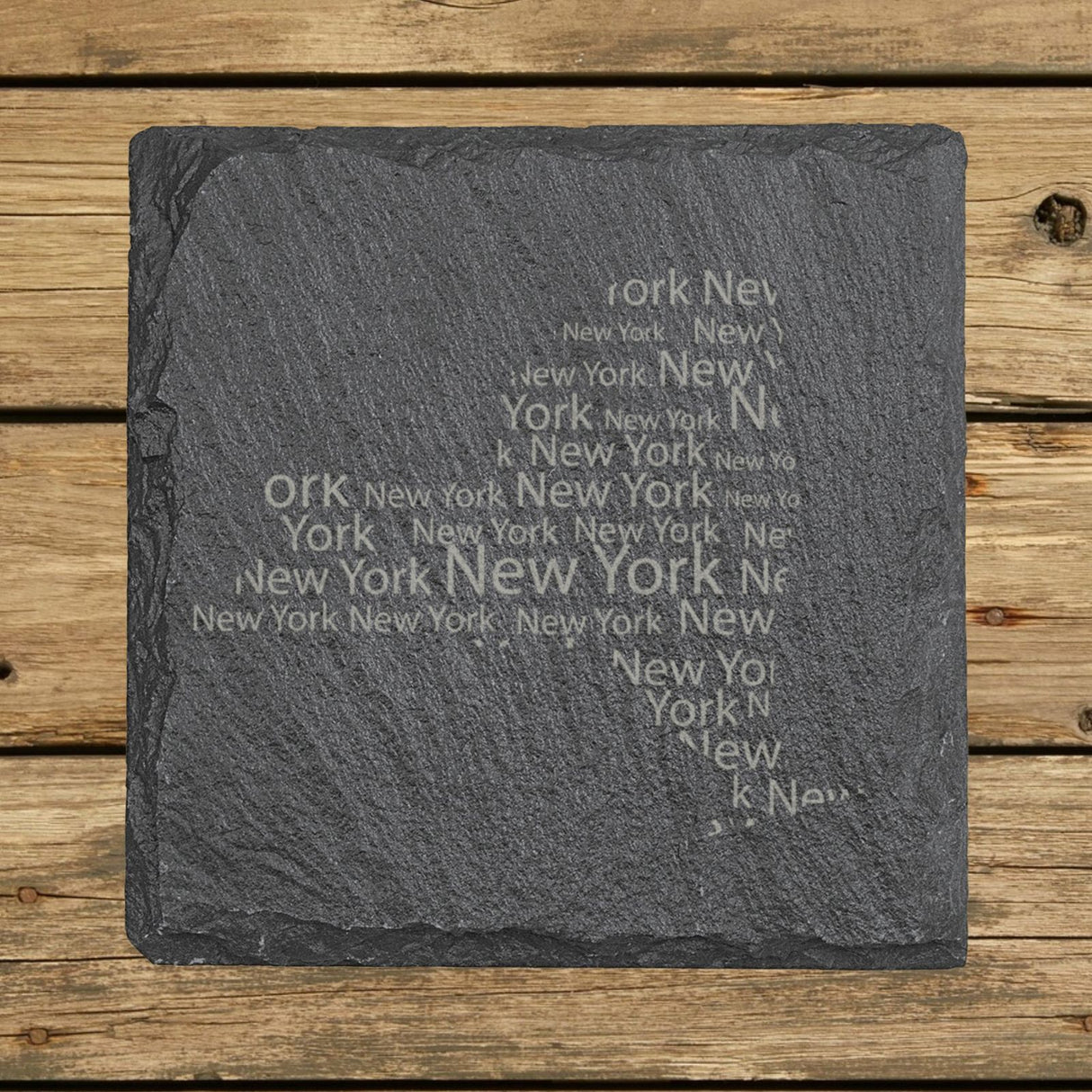 New York square slate coaster engraved with a word cloud of repeating New York text